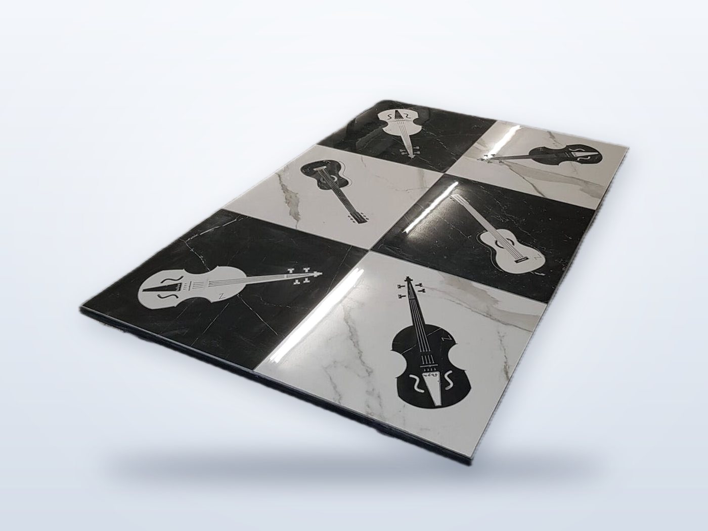 Marble tiles with waterjet-cut violin and guitar inlays